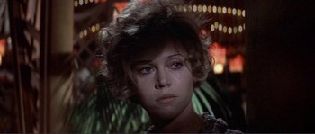 Movie still from “They Shoot Horses, Don't They?” (1969), directed by Sydney Pollack – A person with short curly hair; Close Up shot, Low angle