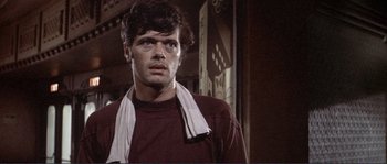 Movie still from “They Shoot Horses, Don't They?” (1969), directed by Sydney Pollack – A person with a towel around his neck; Close Up shot, Low angle