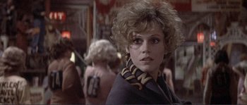 Movie still from “They Shoot Horses, Don't They?” (1969), directed by Sydney Pollack – A person wearing a jacket; Close Up shot, Over the shoulder angle