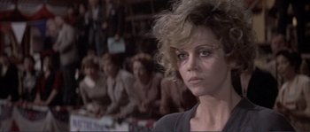 Movie still from “They Shoot Horses, Don't They?” (1969), directed by Sydney Pollack – A person with a crowd of people in the background; Close Up shot, Low angle