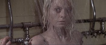 Movie still from “They Shoot Horses, Don't They?” (1969), directed by Sydney Pollack – A woman in the shower taking a selfie; Close Up shot, Low angle
