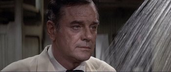 Movie still from “They Shoot Horses, Don't They?” (1969), directed by Sydney Pollack – An older man wearing a white dress shirt and a tie; Close Up shot, High angle