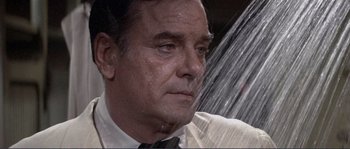 Movie still from “They Shoot Horses, Don't They?” (1969), directed by Sydney Pollack – An older man in a white dress shirt and a tie; Close Up shot, High angle