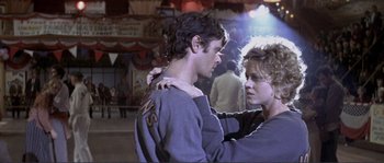 Movie still from “They Shoot Horses, Don't They?” (1969), directed by Sydney Pollack – A man and a woman are dancing in a room; Medium shot, Low angle