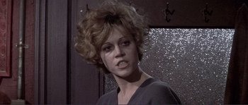 Movie still from “They Shoot Horses, Don't They?” (1969), directed by Sydney Pollack – A person wearing a black shirt; Close Up shot, Low angle