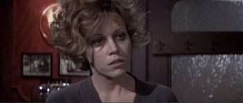 Movie still from “They Shoot Horses, Don't They?” (1969), directed by Sydney Pollack – A person wearing a black shirt; Close Up shot, Low angle