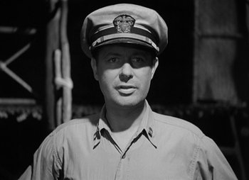 Movie still from “They Were Expendable” (1945), directed by Robert Montgomery – Black and white photograph of a man wearing a hat; Close Up shot, Low angle