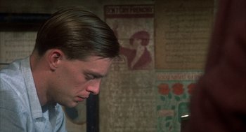 Movie still from “Thieves Like Us” (1974), directed by Robert Altman – A young man is looking down at his face; Close Up shot, High angle