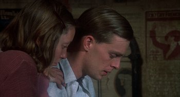 Movie still from “Thieves Like Us” (1974), directed by Robert Altman – A man and a woman looking down at one another; Close Up shot, Low angle