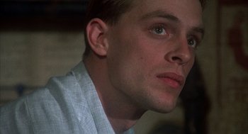 Movie still from “Thieves Like Us” (1974), directed by Robert Altman – A man's face as he looks into the distance; Close Up shot, Low angle