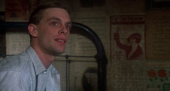 Movie still from “Thieves Like Us” (1974), directed by Robert Altman – A young man looking up at the ceiling; Close Up shot, Low angle