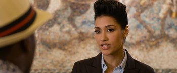 Movie still from “Think Like a Man Too” (2014), directed by Tim Story – A person wearing a suit and tie; Close Up shot, Over the shoulder angle