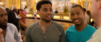 Movie still from “Think Like a Man Too” (2014), directed by Tim Story – A man and a woman standing next to each other; Close Up shot, Over the shoulder angle