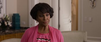 Movie still from “Think Like a Man Too” (2014), directed by Tim Story – An older black woman wearing a pink dress; Close Up shot, Over the shoulder angle