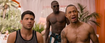 Movie still from “Think Like a Man Too” (2014), directed by Tim Story – A group of men standing next to each other; Medium shot, Over the shoulder angle