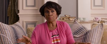 Movie still from “Think Like a Man Too” (2014), directed by Tim Story – An older black woman wearing a pink shirt; Close Up shot, Over the shoulder angle