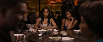 Movie still from “Think Like a Man Too” (2014), directed by Tim Story – Two women sitting at a table with a plate of food; Medium shot, High angle