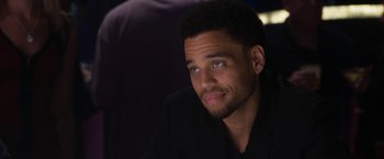 Movie still from “Think Like a Man Too” (2014), directed by Tim Story – A person wearing a suit; Close Up shot, Over the shoulder angle