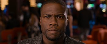 Movie still from “Think Like a Man Too” (2014), directed by Tim Story – A person with a serious look on his face; Close Up shot, Over the shoulder angle