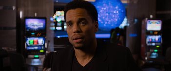 Movie still from “Think Like a Man Too” (2014), directed by Tim Story – A person wearing a suit; Close Up shot, Over the shoulder angle