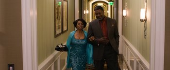 Movie still from “Think Like a Man Too” (2014), directed by Tim Story – A man and a woman walking down a hall way; Medium shot, Low angle