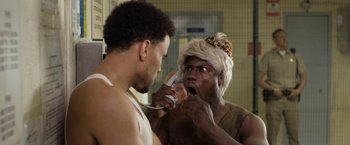 Movie still from “Think Like a Man Too” (2014), directed by Tim Story – A man is brushing his teeth in front of a mirror; Close Up shot, Over the shoulder angle