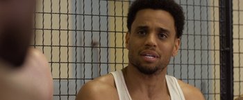 Movie still from “Think Like a Man Too” (2014), directed by Tim Story – A person wearing a tank top; Close Up shot, Over the shoulder angle