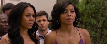 Movie still from “Think Like a Man Too” (2014), directed by Tim Story – A group of people standing next to each other; Close Up shot, Over the shoulder angle