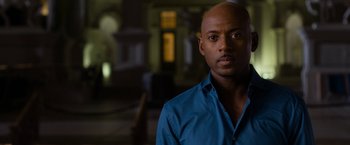 Movie still from “Think Like a Man Too” (2014), directed by Tim Story – A man in a blue shirt is looking at the camera; Close Up shot, Over the shoulder angle