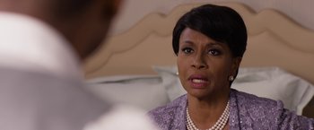 Movie still from “Think Like a Man Too” (2014), directed by Tim Story – A woman in a purple dress and a pearl necklace; Close Up shot, Over the shoulder angle