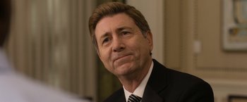 Movie still from “Think Like a Man Too” (2014), directed by Tim Story – A person wearing a suit and tie; Close Up shot, Over the shoulder angle