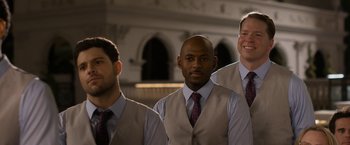 Movie still from “Think Like a Man Too” (2014), directed by Tim Story – A group of men standing next to each other wearing ties; Medium shot, Over the shoulder angle
