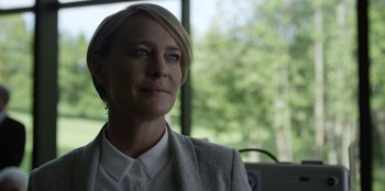 Movie still from “House of Cards” (2013), created by Beau Willimon – A person wearing a jacket; Close Up shot, Over the shoulder angle