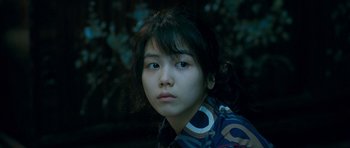 Movie still from “Thirst” (2009), directed by Park Chan-wook – A young woman is looking into the camera; Close Up shot, High angle