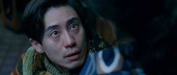 Movie still from “Thirst” (2009), directed by Park Chan-wook – A person with a nose ring; Extreme Close Up shot, Over the shoulder angle