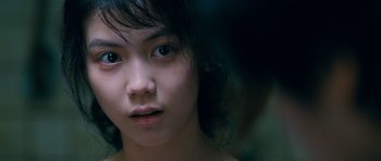 Movie still from “Thirst” (2009), directed by Park Chan-wook – A young woman's face; Close Up shot, Over the shoulder angle