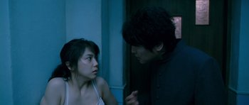 Movie still from “Thirst” (2009), directed by Park Chan-wook – A man and a woman talking in front of each other; Medium shot, Over the shoulder angle