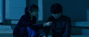 Movie still from “Thirst” (2009), directed by Park Chan-wook – A man and a woman in a dark room; Medium shot, High angle