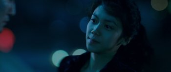 Movie still from “Thirst” (2009), directed by Park Chan-wook – A young woman is looking into the distance; Close Up shot, Over the shoulder angle