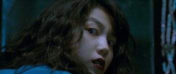 Movie still from “Thirst” (2009), directed by Park Chan-wook – The face of a young girl; Close Up shot, Low angle