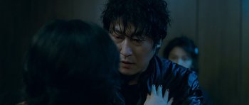 Movie still from “Thirst” (2009), directed by Park Chan-wook – A person with their face close to another person; Close Up shot, Over the shoulder angle