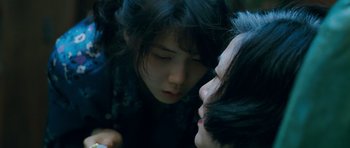 Movie still from “Thirst” (2009), directed by Park Chan-wook – Two people are looking at each other in the dark; Close Up shot, Over the shoulder angle
