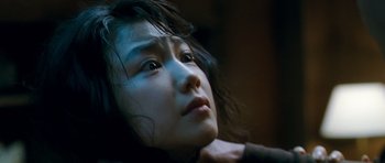 Movie still from “Thirst” (2009), directed by Park Chan-wook – A person looking at the camera; Close Up shot, High angle