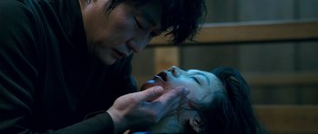 A young man and a young woman with blood on their face