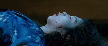 Movie still from “Thirst” (2009), directed by Park Chan-wook – A woman with blood all over her face and neck; Close Up shot, Overhead angle