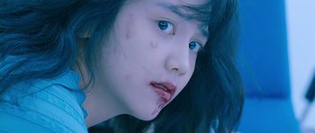 Movie still from “Thirst” (2009), directed by Park Chan-wook – A young girl with blood all over her face; Close Up shot, Overhead angle
