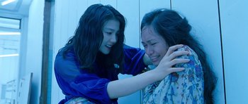 Movie still from “Thirst” (2009), directed by Park Chan-wook – Two young women are combing each other's hair; Close Up shot, Over the shoulder angle