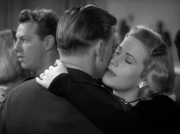 Movie still from “Thirty Seconds Over Tokyo” (1944), directed by Mervyn LeRoy – A man and a woman hugging each other; Close Up shot, Over the shoulder angle