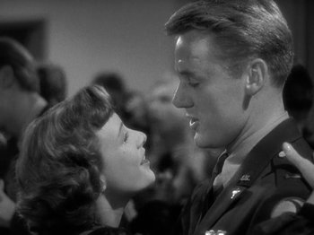 Movie still from “Thirty Seconds Over Tokyo” (1944), directed by Mervyn LeRoy – A man and a woman are looking at each other; Close Up shot, Low angle