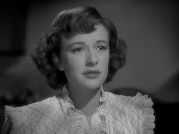 Movie still from “Thirty Seconds Over Tokyo” (1944), directed by Mervyn LeRoy – A black - and - white photo of a young woman; Close Up shot, High angle